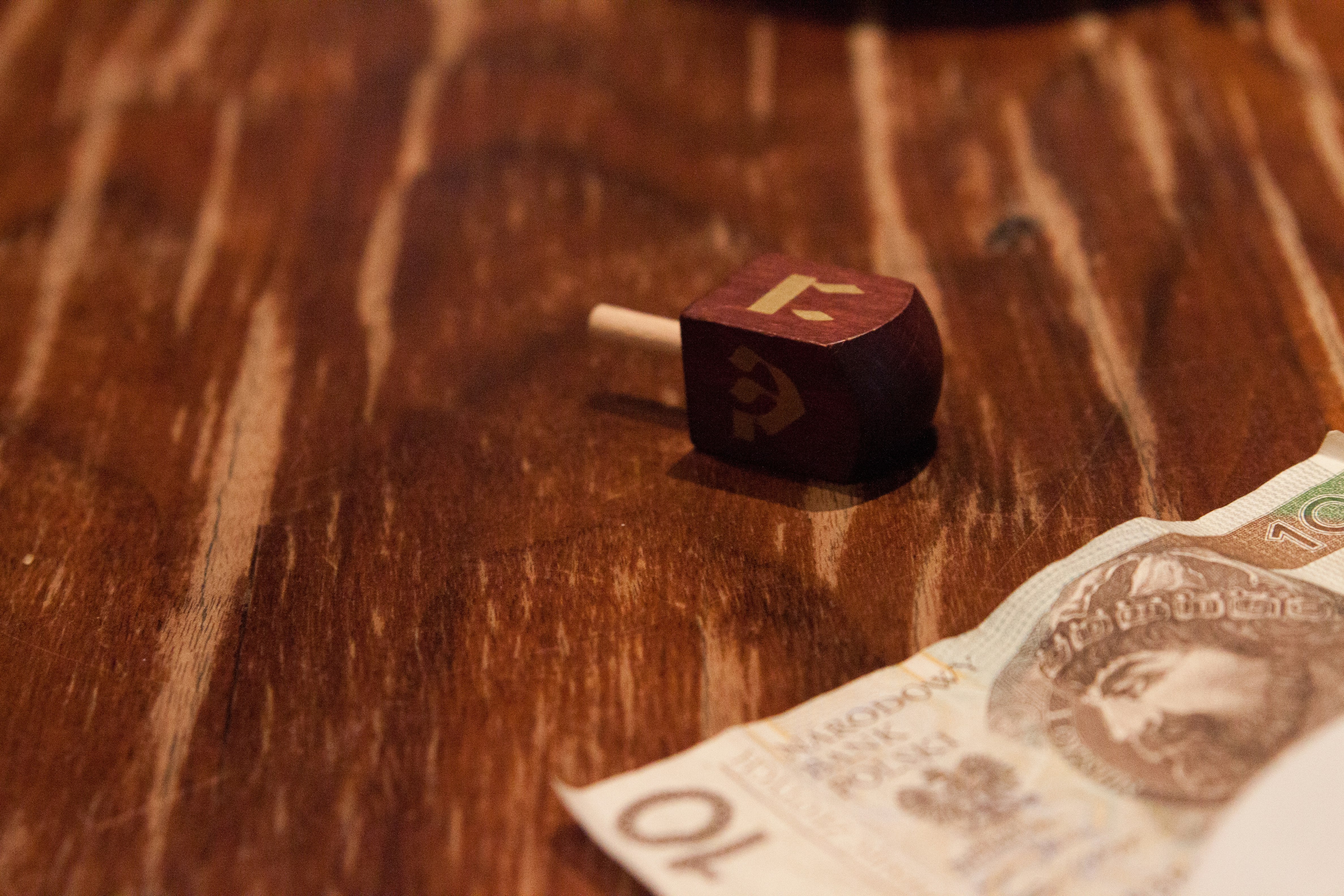 10 banknote on brown wooden table